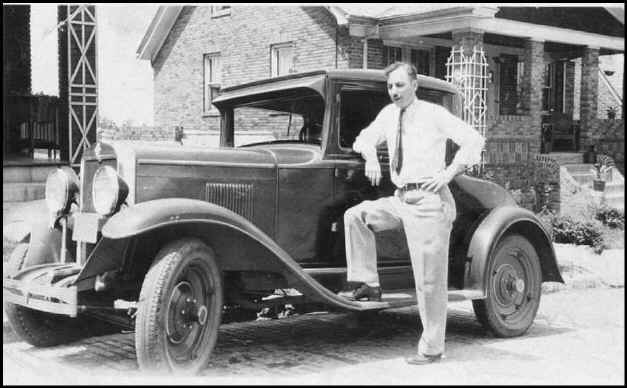 Bernard Lynn Poch with his Chevrolet in Pittsburgh, Pennsylvania.